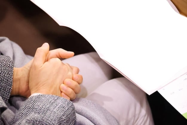Two hands clasped together over a table with financial documents spread around, showing collaboration and support in financial planning. The lighting is warm and inviting.