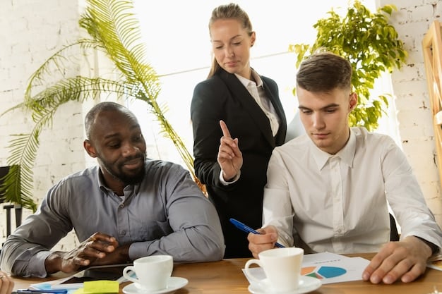 A diverse team discussing business strategies around a table, emphasizing collaboration and strategic planning in response to the tax change.