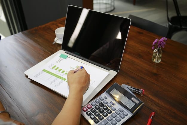 A person reviewing a budget spreadsheet on a laptop with a calculator nearby.