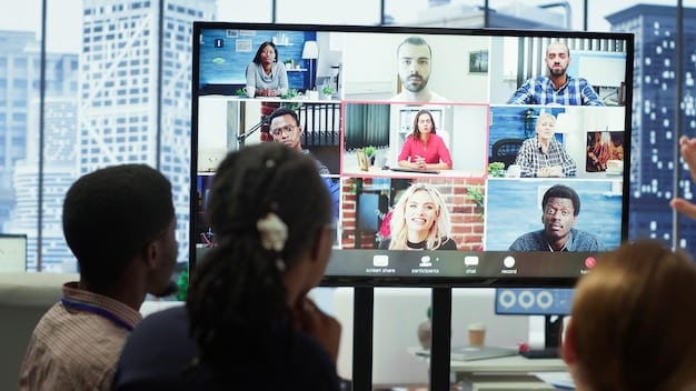 A diverse group of people participating in a virtual meeting. The screen is filled with different faces, and some participants are gesturing and smiling, creating a sense of connection despite the distance.